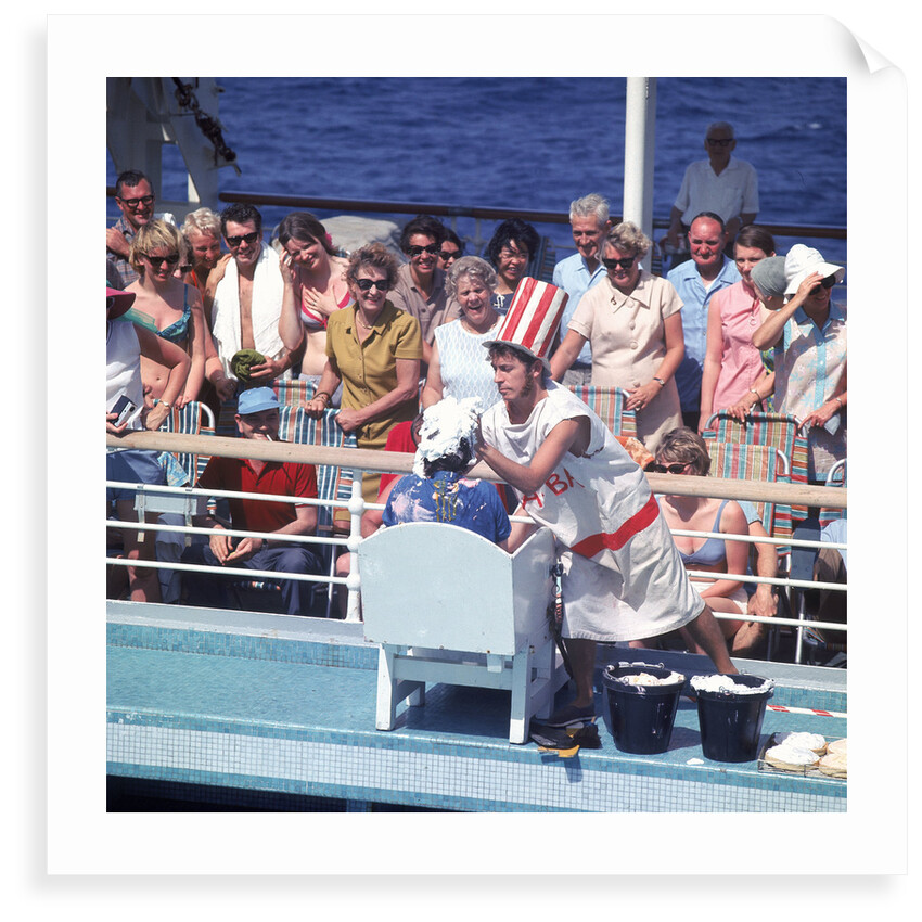 Comic hijinx aboard an unspecified cruise ship keeps the passengers entertained during the voyage - perhaps a variant of the Crossing the Line (the Equator) ceremony? by Marine Photo Service