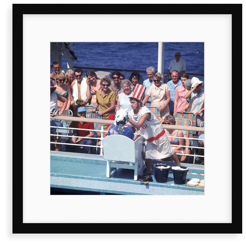 Comic hijinx aboard an unspecified cruise ship keeps the passengers entertained during the voyage - perhaps a variant of the Crossing the Line (the Equator) ceremony? by Marine Photo Service