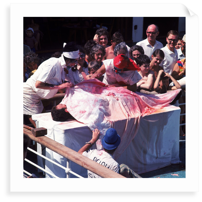 Macabre comic entertainment aboard an unspecified cruise ship - perhaps a variant of the Crossing the Line (the Equator) ceremony? by Marine Photo Service