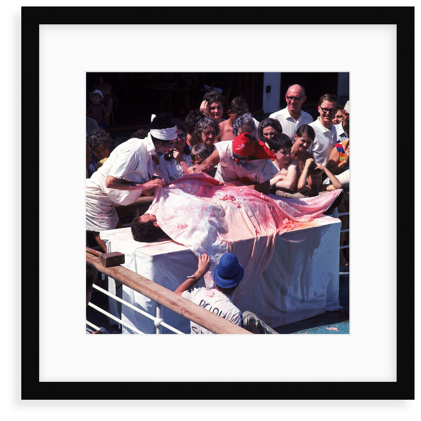 Macabre comic entertainment aboard an unspecified cruise ship - perhaps a variant of the Crossing the Line (the Equator) ceremony? by Marine Photo Service