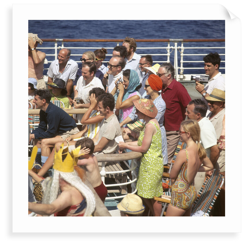 Interested passengers, young and old, enjoy on-deck entertainment aboard an unspecified cruise liner by Marine Photo Service