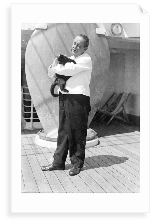 Steward with ship's cat by Marine Photo Service