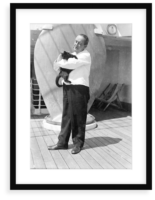 Steward with ship's cat by Marine Photo Service