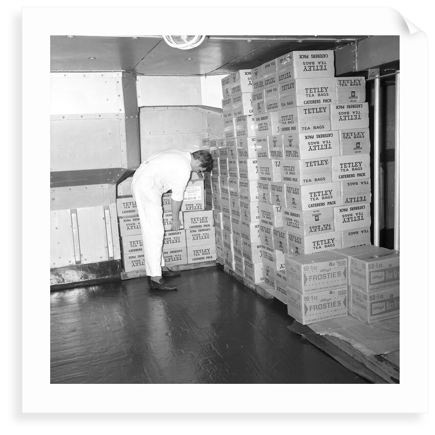 A storeroom containing boxes of Tetley's tea bags and Kellogg's Frosties, onboard 'Iberia' (1954) by Marine Photo Service