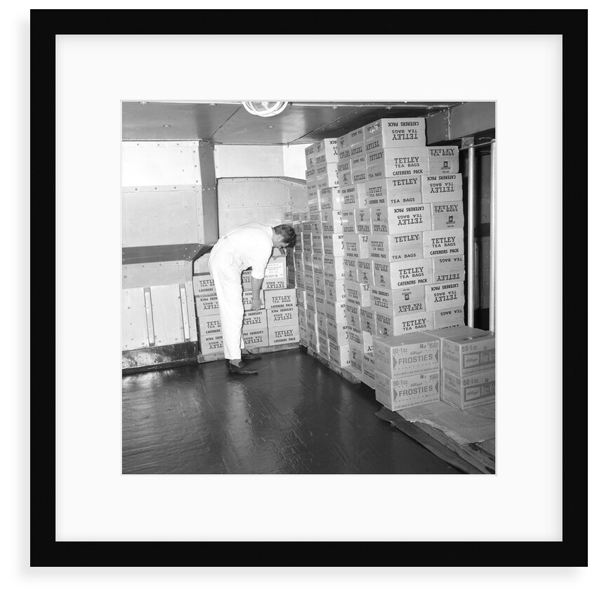 A storeroom containing boxes of Tetley's tea bags and Kellogg's Frosties, onboard 'Iberia' (1954) by Marine Photo Service