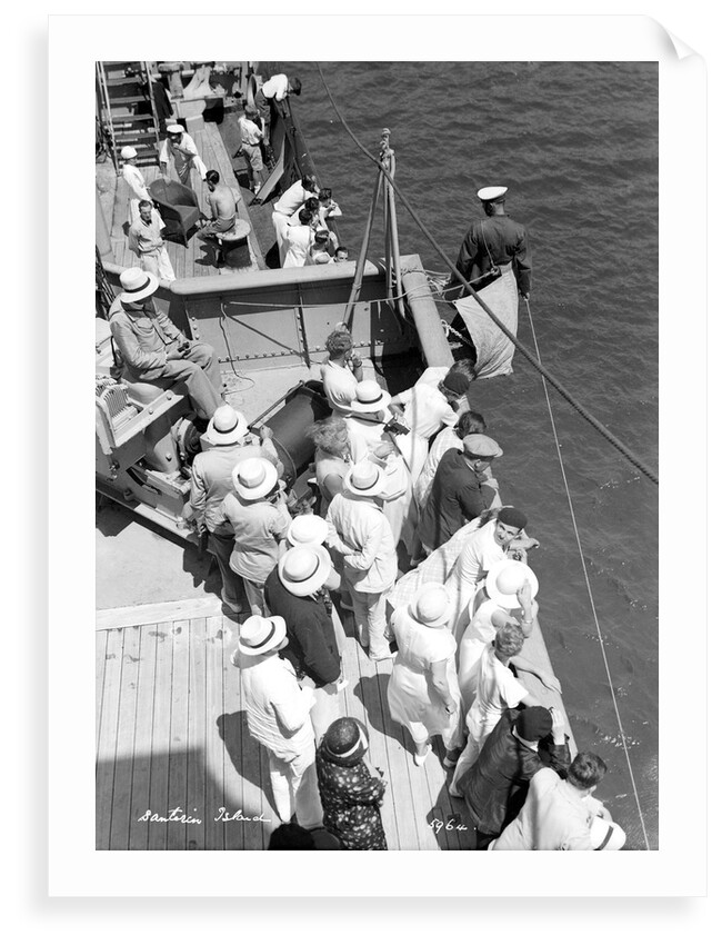 A sailor takes a sounding as the ship approaches the Greek island of Santorini by Marine Photo Service