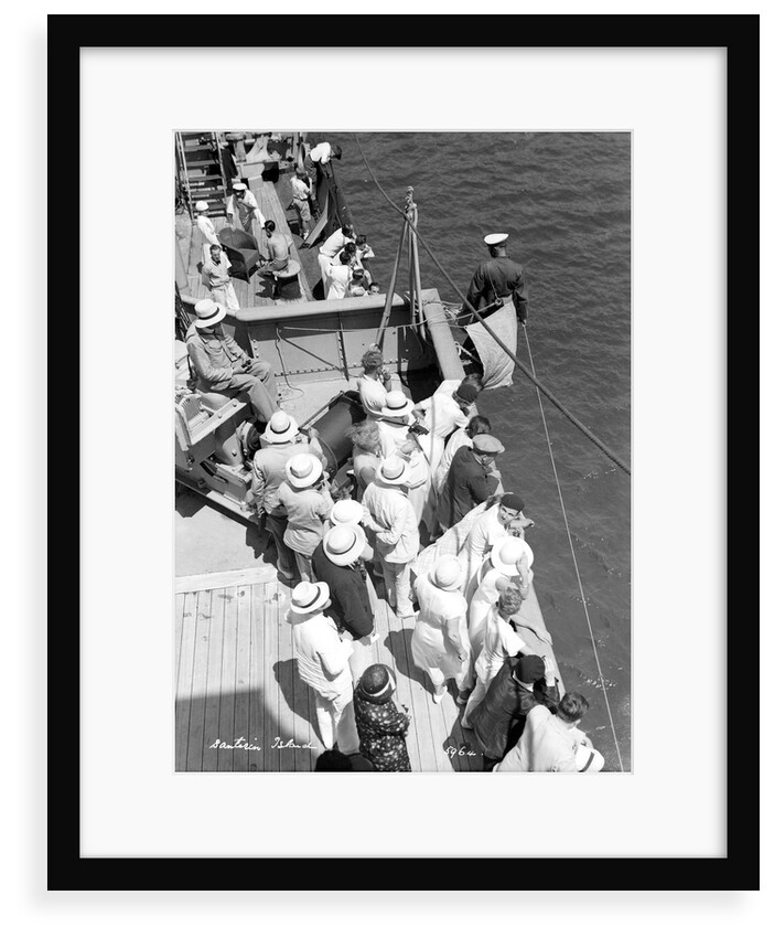 A sailor takes a sounding as the ship approaches the Greek island of Santorini by Marine Photo Service