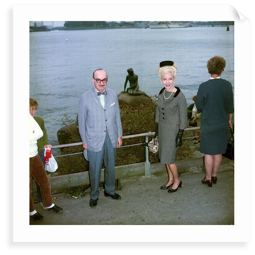 Unidentified couple posing in front of the Mermaid sculpture, Copenhagen, Denmark by Marine Photo Service