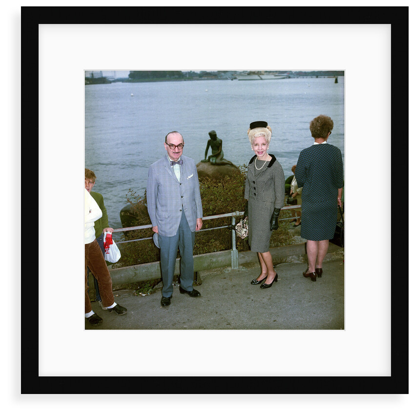 Unidentified couple posing in front of the Mermaid sculpture, Copenhagen, Denmark by Marine Photo Service