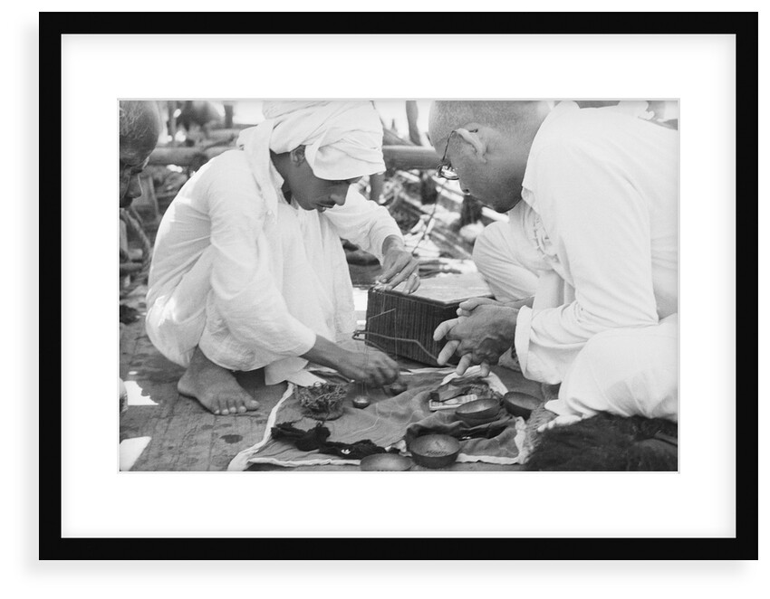 Pearl buyers examining pearls by Alan Villiers