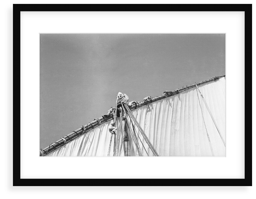 Kuwaiti sailors working the sail by Alan Villiers