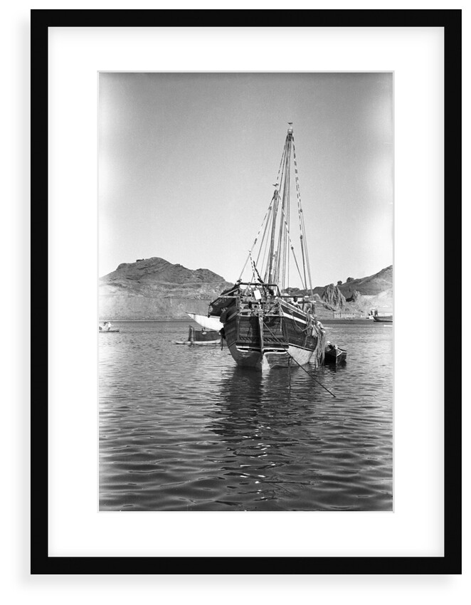 A small Yemeni sambuk lies at anchor, Ma'alla by Alan Villiers