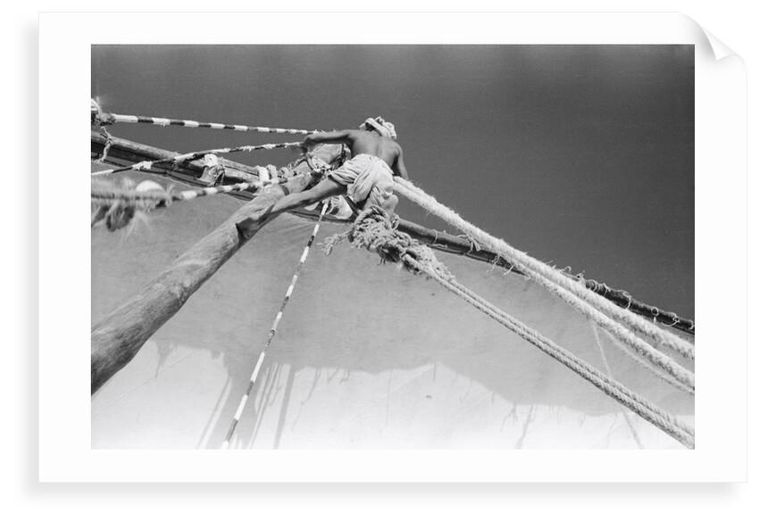 Man up aloft on the 'Sheikh Mansur' by Alan Villiers
