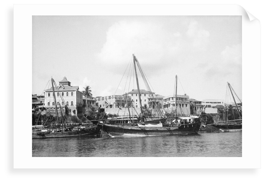 Booms anchored along the waterfront at Mombasa, Kenya by Alan Villiers