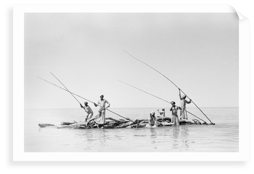 Imported ship-building timbers were poled from dhow to boatyard by Alan Villiers