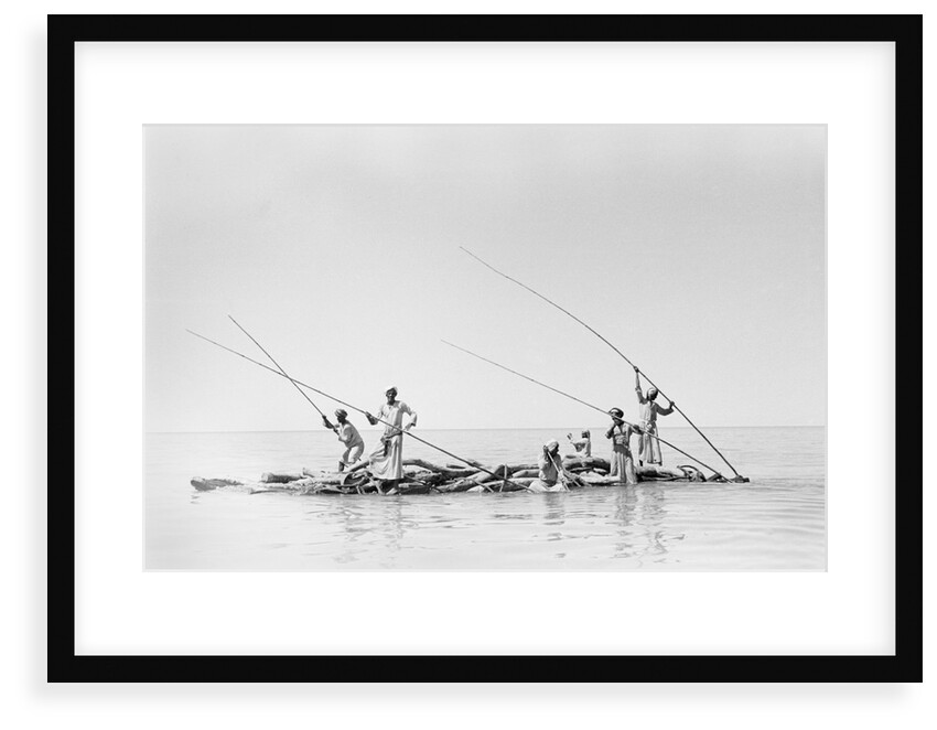Imported ship-building timbers were poled from dhow to boatyard by Alan Villiers