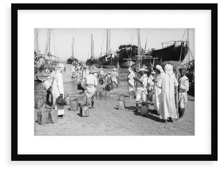 Water carriers filling their cans by Alan Villiers