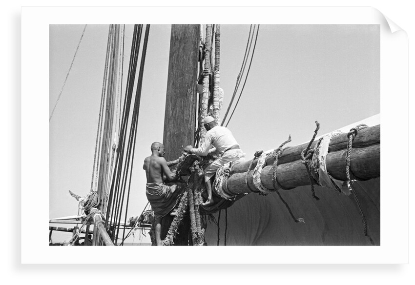Sailors bend the halyards of the mainsail, Zanzibar by Alan Villiers