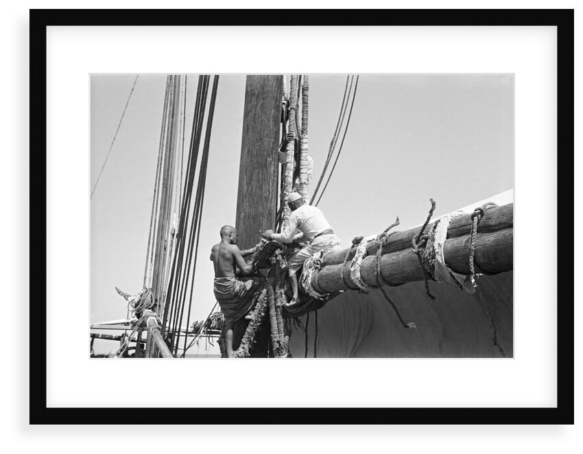 Sailors bend the halyards of the mainsail, Zanzibar by Alan Villiers