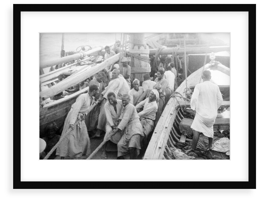 Sailors hoisting the main yard by Alan Villiers