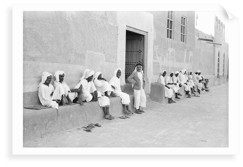 Sailors relaxing outside a merchant's house by Alan Villiers