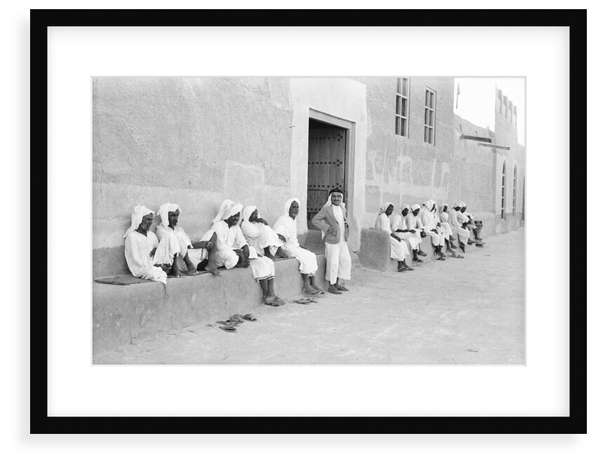 Sailors relaxing outside a merchant's house by Alan Villiers