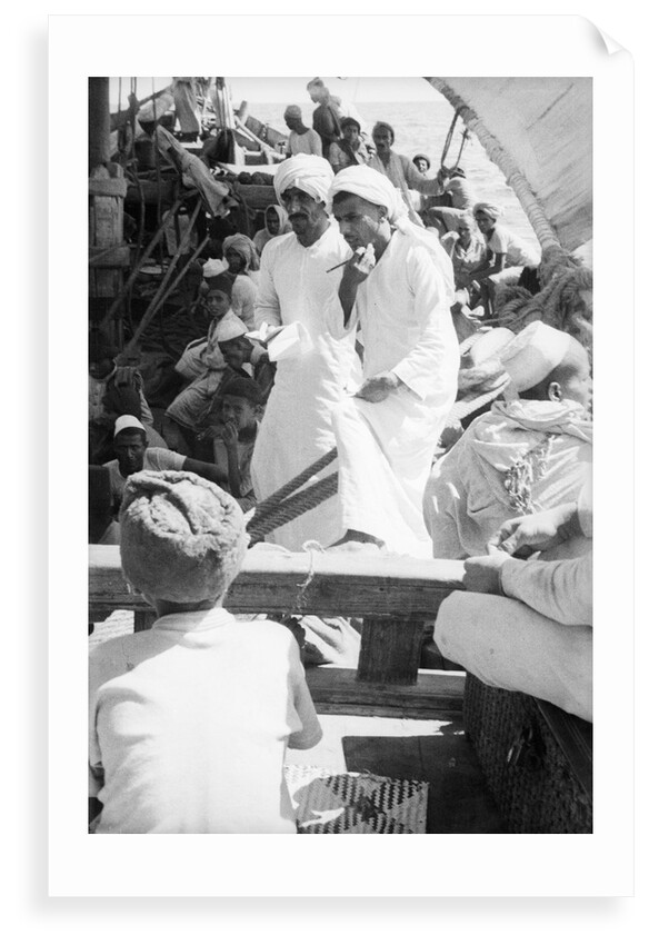 Nejdi and the mate, Hamed bin Salim, check passengers from Hadramuaut crowded on board the 'Triumph' by Alan Villiers