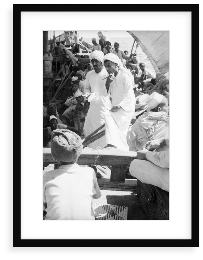 Nejdi and the mate, Hamed bin Salim, check passengers from Hadramuaut crowded on board the 'Triumph' by Alan Villiers
