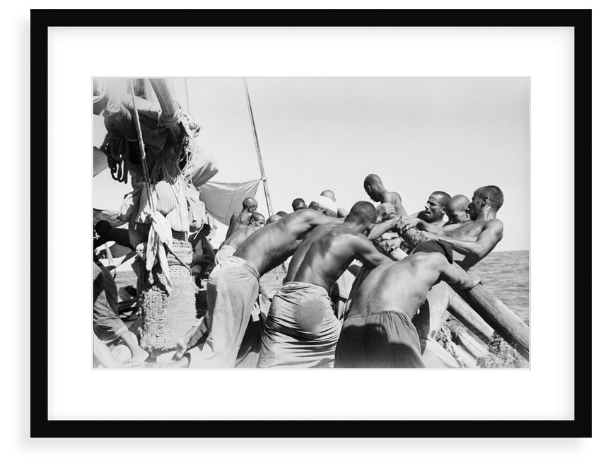 Crew rowing a pearler by Alan Villiers