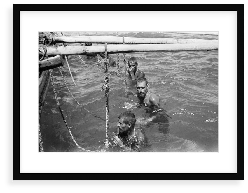 Pearl divers in the water by Alan Villiers