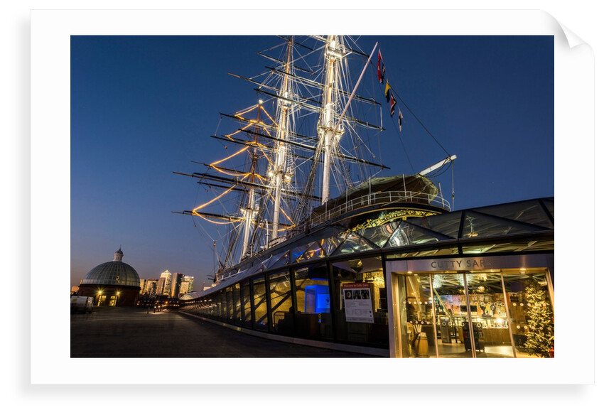 Cutty Sark port side views of the ship at sunset with Christmas tree decoration by National Maritime Museum