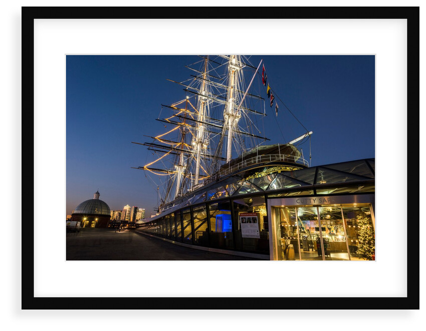 Cutty Sark port side views of the ship at sunset with Christmas tree decoration by National Maritime Museum