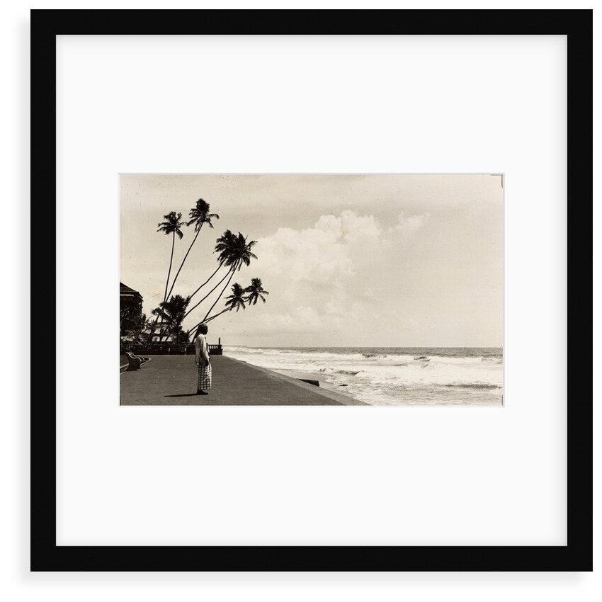 A landscape photograph of a Sri Lankan man looking out to sea. by Unknown