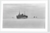Merchant ships steaming through thin sea ice by unknown