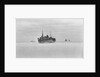 Merchant ships steaming through thin sea ice by unknown