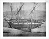 Broadside view of two unidentified vessels at low tide by unknown