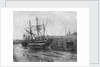 Stern quater view of copper ship and others aground at low tide by unknown