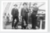Second Officer, Captain H.J. Bray (with dog Ollie) and Chief Officer standing on deck, at Tacoma, USA by unknown