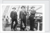 Second Officer, Captain H.J. Bray (with dog Ollie) and Chief Officer standing on deck, at Tacoma, USA by unknown