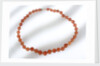 Amber beads by unknown