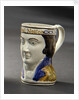 Earthenware mask mug by unknown
