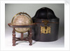 Sphere on stand, beside case by James Ferguson