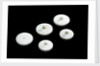 Three large and two small crucible lids by unknown