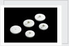 Three large and two small crucible lids by unknown