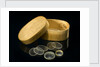 Nine lenses of various sizes in a box by Unknown