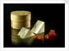Pill box containing two prisms and red coloured crystals by unknown