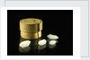 Pill box containing four cloudy white crystals by Unknown