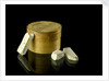 Pill box containing eight chalky plaster like crystals by unknown