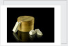 Pill box containing eight chalky plaster like crystals by unknown