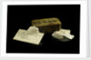 A tobacco tin containing pieces of quartz. by Unknown